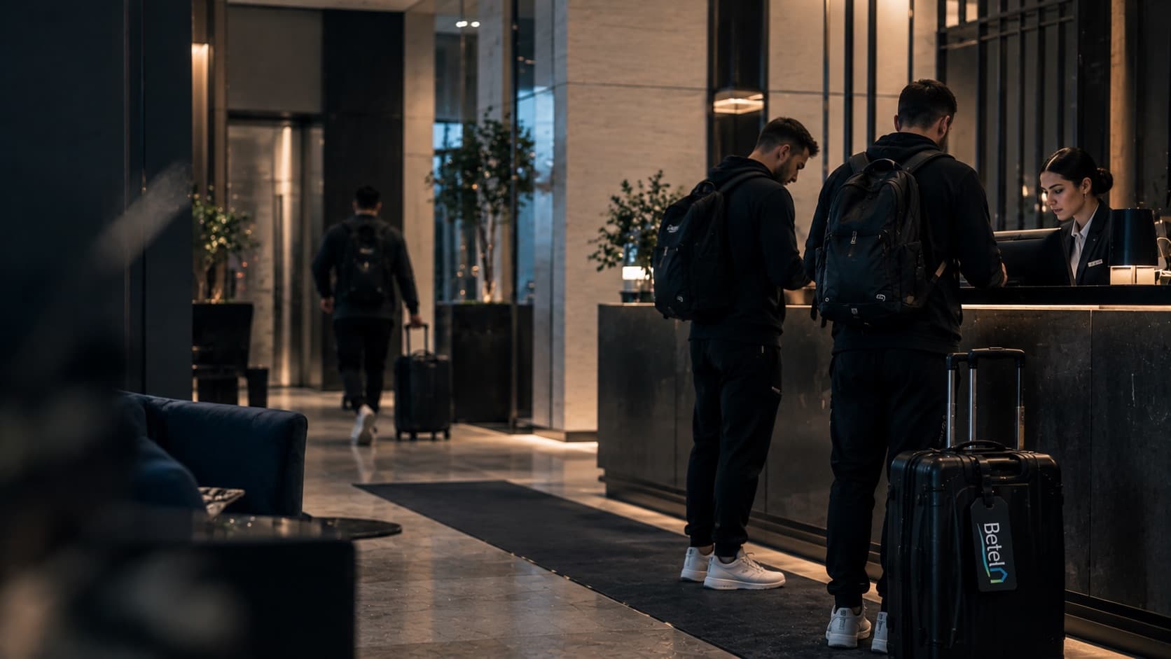 Check-in alla reception di un hotel per una squadra in trasferta
